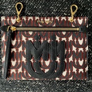Miu Miu Black and Red/Brown Clutch in Logo Canvas Print